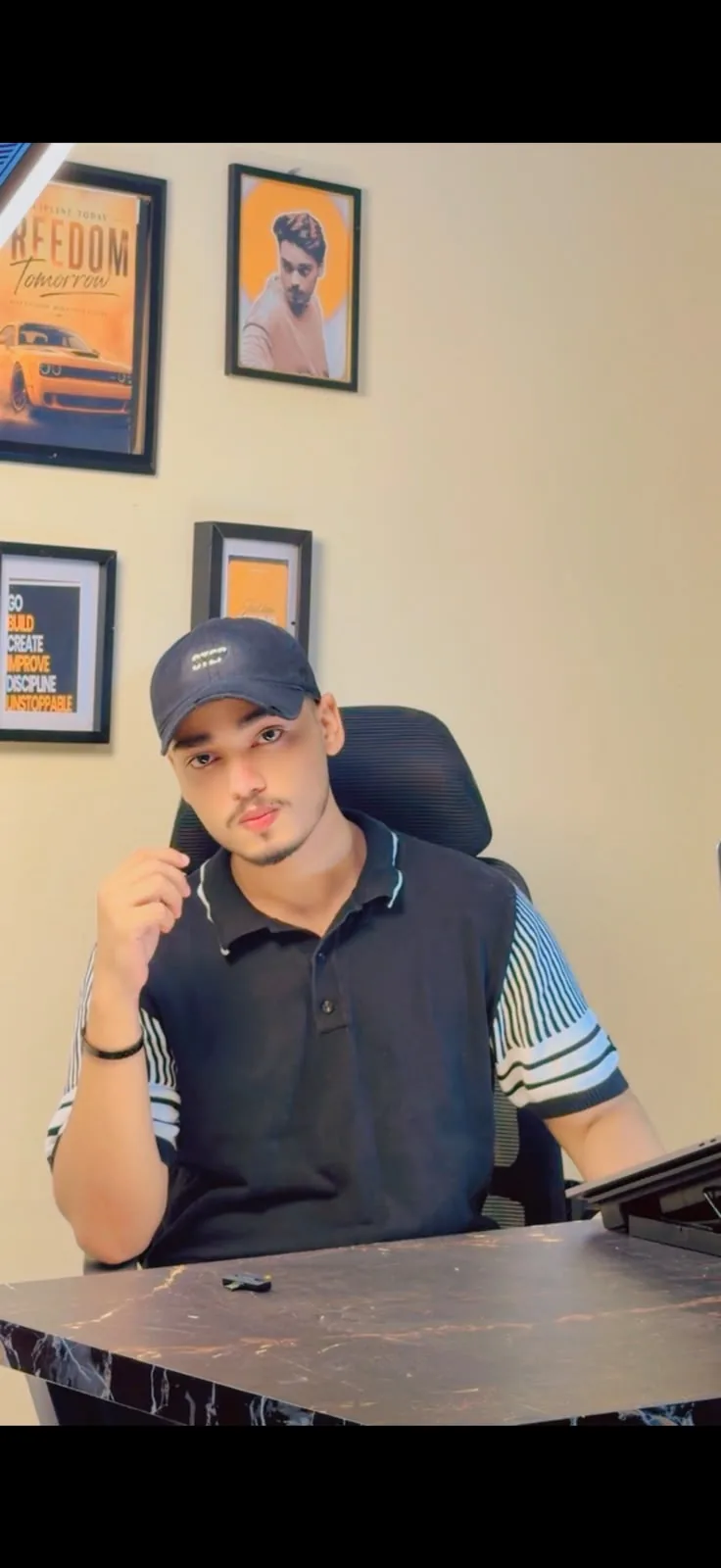 Taha Rajput, real estate content creator and social media specialist, at his workspace
